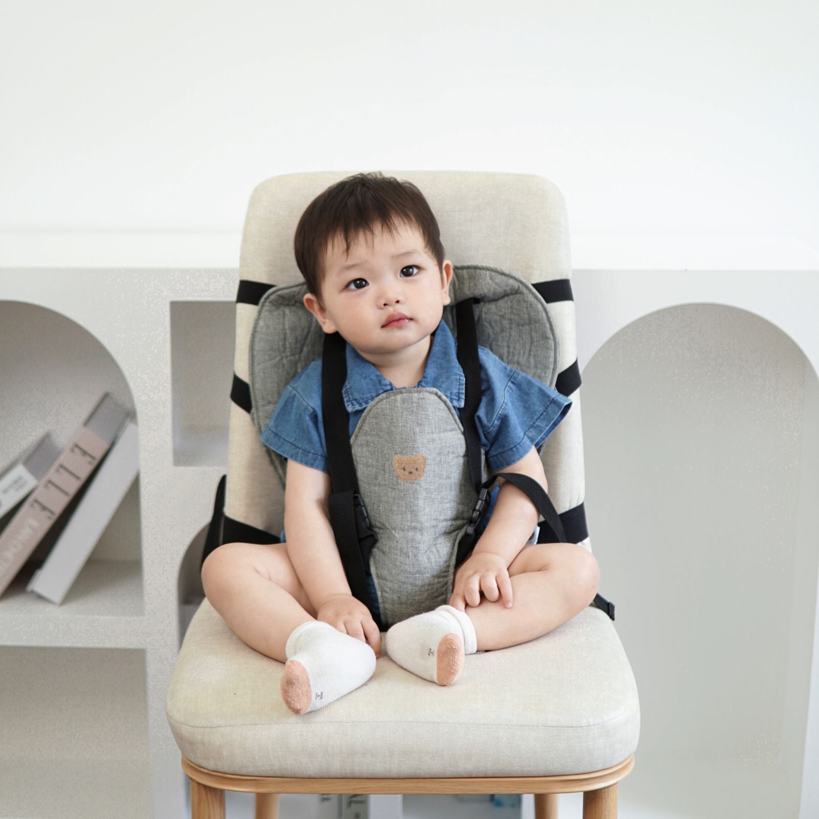 Bevestigingsriem voor baby eetstoelkussen